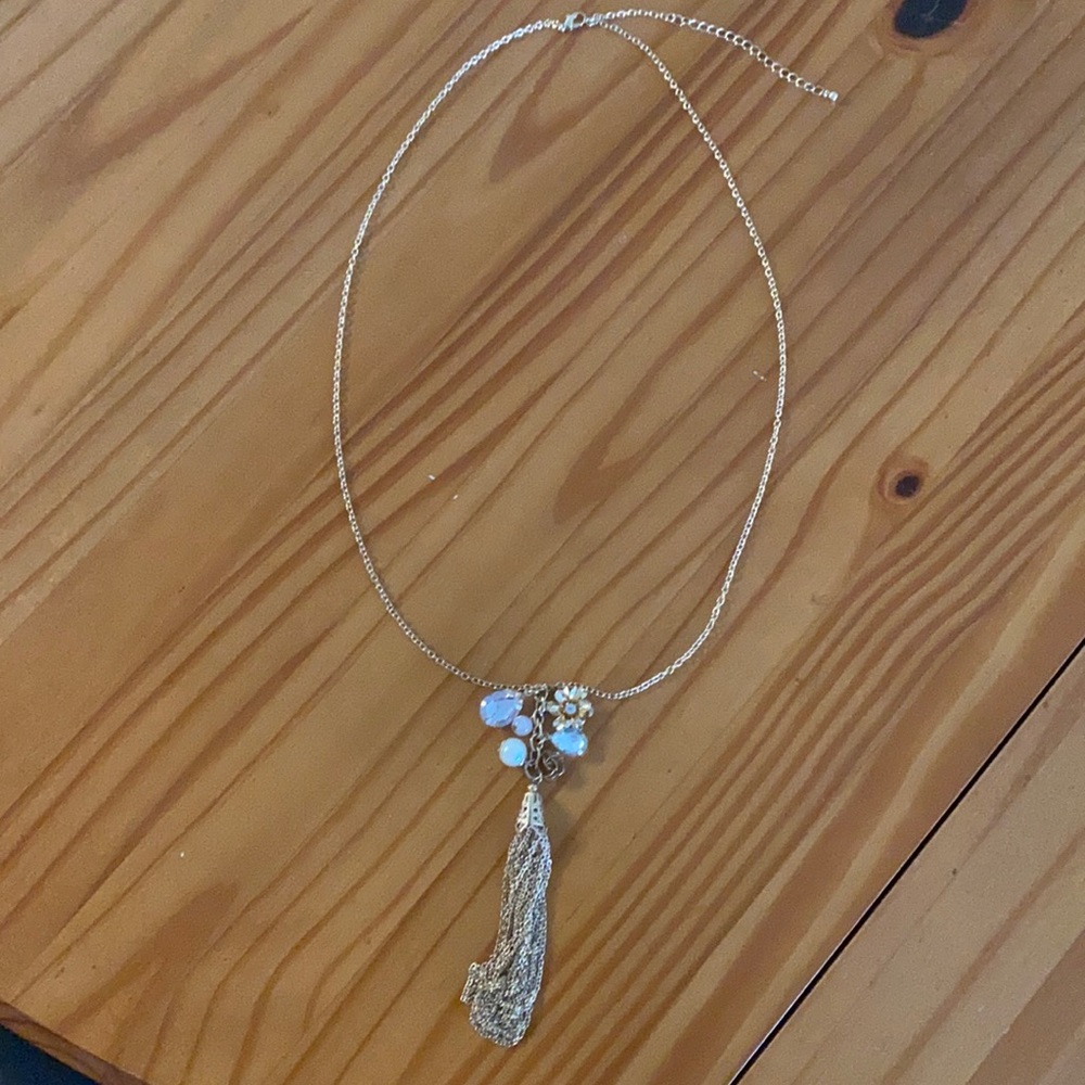 Long gold tassel and charm necklace